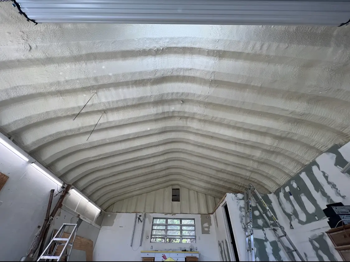 Spray polyurethane foam applied to the underside of a metal roof deck in Goshen